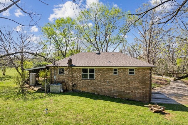 1190 Corum Hill Rd, Castalian Springs, TN 37031 - rear view of house with brick siding and a lawn