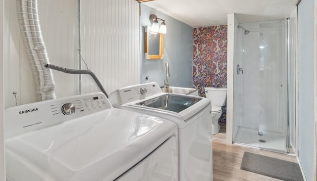 1190 Corum Hill Rd, Castalian Springs, TN 37031 - laundry room featuring independent washer and dryer, light wood finished floors, and wallpapered walls