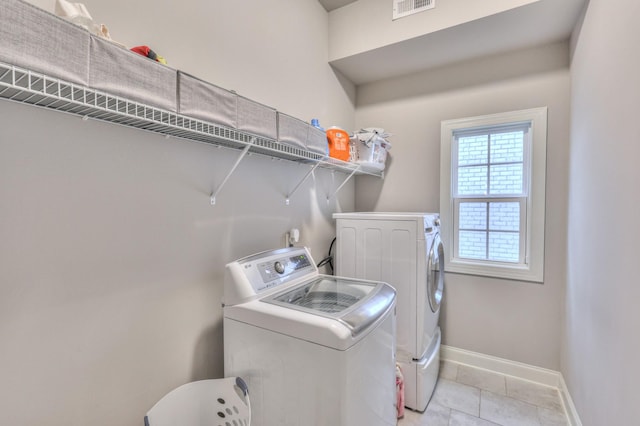 3433 Cortona Way, Murfreesboro, TN 37129 - washroom with washing machine and clothes dryer, baseboards, and light tile patterned flooring
