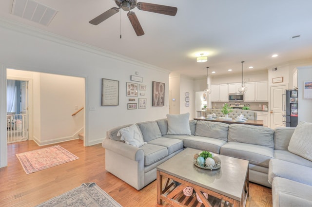 3433 Cortona Way, Murfreesboro, TN 37129 - living area with ornamental molding, recessed lighting, light wood-type flooring, stairs, and ceiling fan