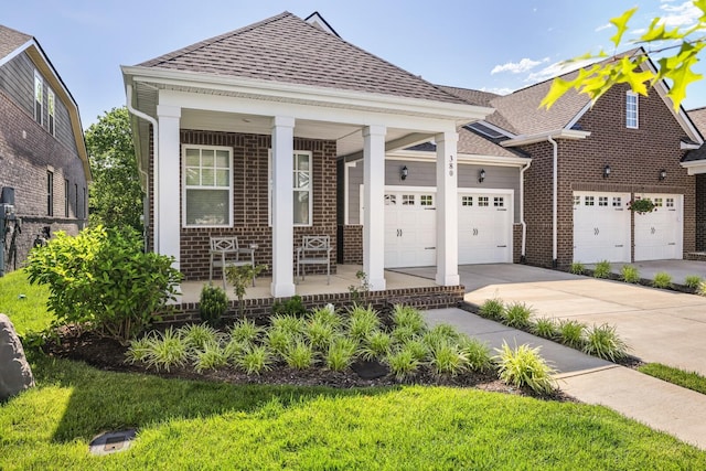 380 Gingerwood Ln, Hendersonville, TN 37075 - view of front of property with driveway, a porch, a shingled roof, and brick siding