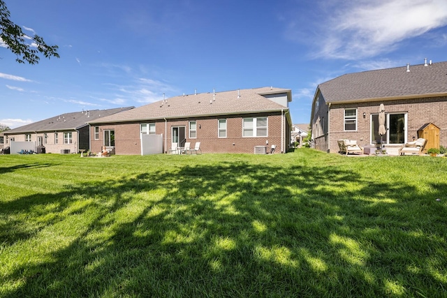 380 Gingerwood Ln, Hendersonville, TN 37075 - rear view of house featuring a lawn, brick siding, and a patio