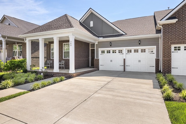 380 Gingerwood Ln, Hendersonville, TN 37075 - view of front of house with brick siding, driveway, a porch, and a shingled roof