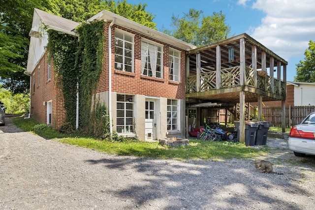 305 Andrews Ave, Hartsville, TN 37074 - view of front of home featuring brick siding and a wooden deck