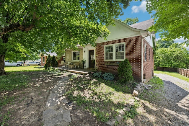 305 Andrews Ave, Hartsville, TN 37074 - view of front of home with brick siding and a wooden deck