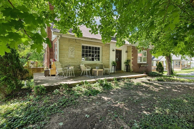 305 Andrews Ave, Hartsville, TN 37074 - view of front of house featuring a deck, stone siding, and brick siding