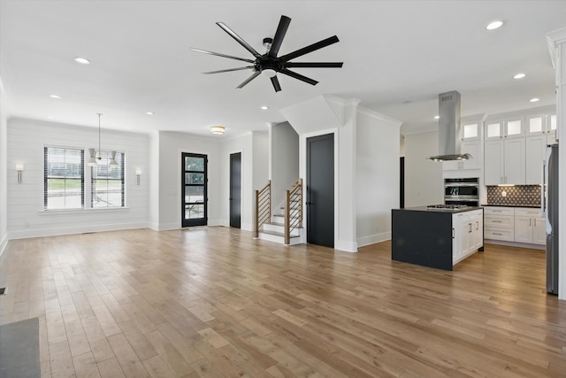329 Lawndale Dr, Nashville, TN 37217 - unfurnished living room featuring baseboards, a ceiling fan, light wood finished floors, recessed lighting, and ornamental molding