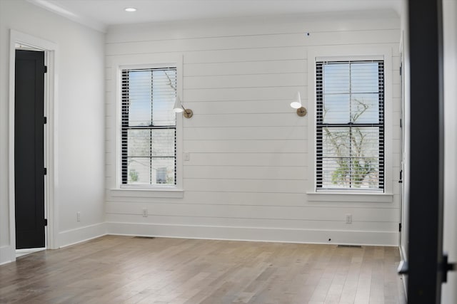 329 Lawndale Dr, Nashville, TN 37217 - empty room with wood finished floors, plenty of natural light, baseboards, and wooden walls