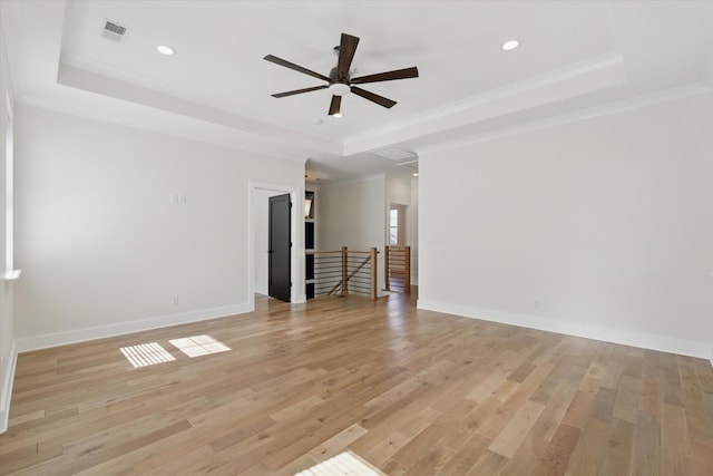 329 Lawndale Dr, Nashville, TN 37217 - unfurnished living room featuring a tray ceiling, ceiling fan, light wood-style flooring, recessed lighting, and ornamental molding