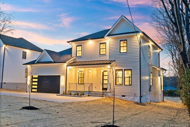 329 Lawndale Dr, Nashville, TN 37217 - view of front facade with covered porch, crawl space, a standing seam roof, an attached garage, and concrete driveway