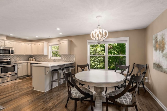 1056 Gilmore Hill Rd, Lebanon, TN 37087 - dining room featuring a chandelier, dark wood-type flooring, baseboards, and recessed lighting