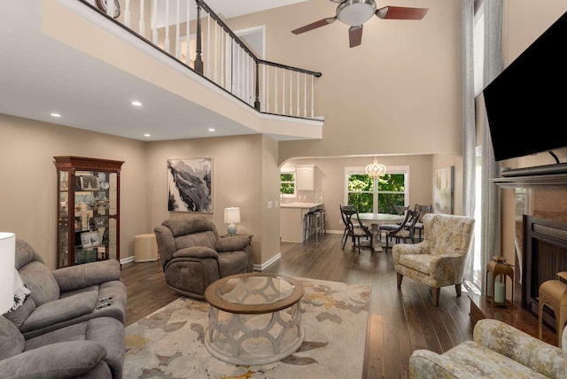 1056 Gilmore Hill Rd, Lebanon, TN 37087 - living room with a high ceiling, hardwood / wood-style flooring, ceiling fan, baseboards, and a fireplace