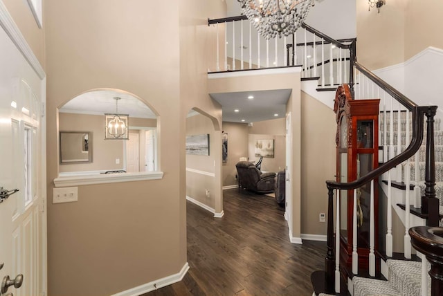 1056 Gilmore Hill Rd, Lebanon, TN 37087 - foyer entrance with a chandelier, arched walkways, a high ceiling, wood finished floors, and stairs