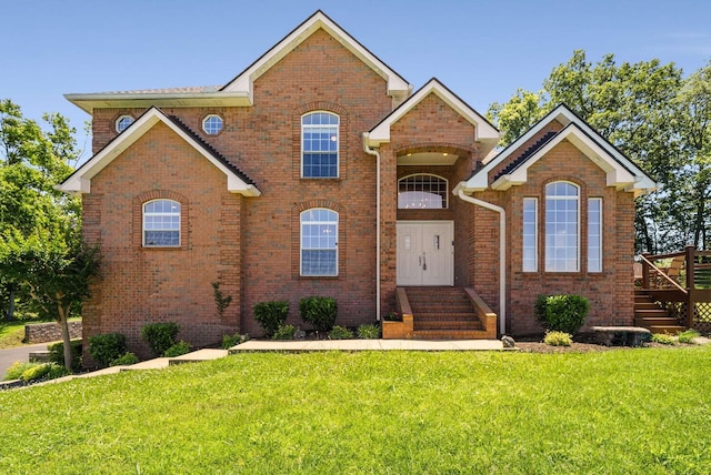 1056 Gilmore Hill Rd, Lebanon, TN 37087 - view of front of house featuring a front lawn, brick siding, and entry steps