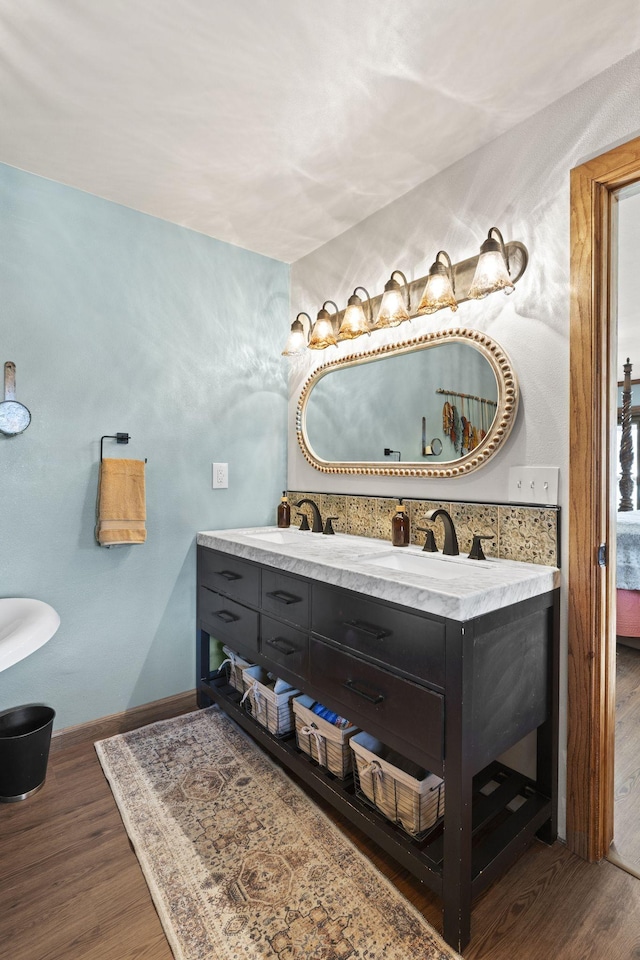 10669 S Windrow Rd, Rockvale, TN 37153 - full bathroom featuring double vanity, wood finished floors, and baseboards