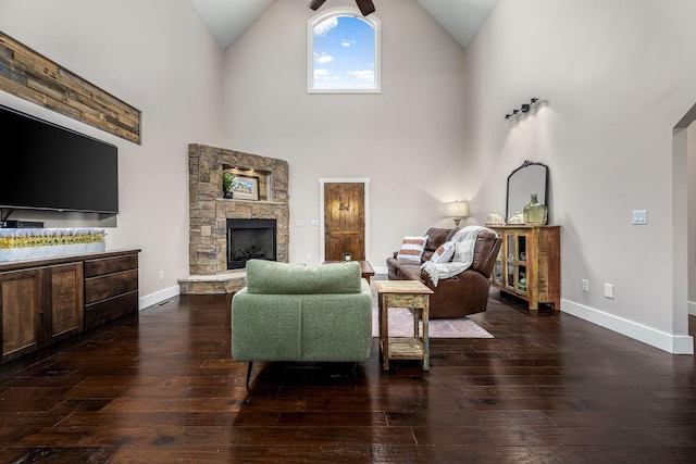 11 Walnut Creek Dr, Manchester, TN 37355 - living room with hardwood / wood-style flooring, a stone fireplace, baseboards, and high vaulted ceiling
