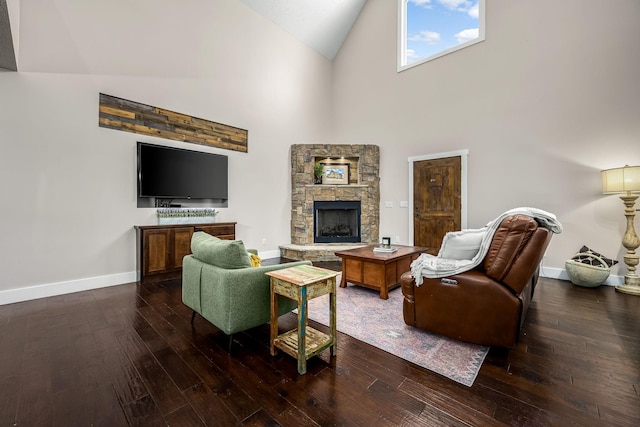 11 Walnut Creek Dr, Manchester, TN 37355 - living area with high vaulted ceiling, hardwood / wood-style floors, baseboards, and a stone fireplace