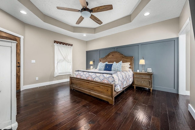 11 Walnut Creek Dr, Manchester, TN 37355 - bedroom with hardwood / wood-style flooring, a tray ceiling, baseboards, and a ceiling fan