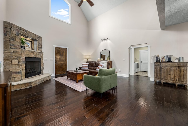 11 Walnut Creek Dr, Manchester, TN 37355 - living room featuring ceiling fan, high vaulted ceiling, a stone fireplace, hardwood / wood-style floors, and baseboards