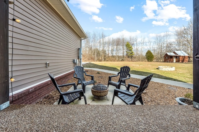 11 Walnut Creek Dr, Manchester, TN 37355 - view of patio / terrace with a fire pit and an outbuilding