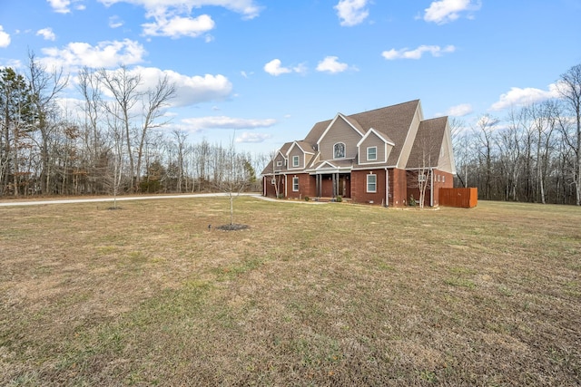 11 Walnut Creek Dr, Manchester, TN 37355 - view of front of house featuring a front yard, brick siding, and a porch
