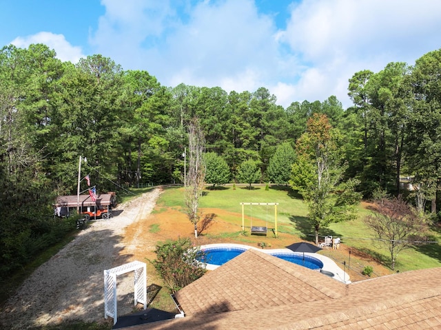 5935 Old Stage Rd, Huntingdon, TN 38344 - swimming pool featuring a patio, an in-ground hot tub, a lawn, and a wooded view