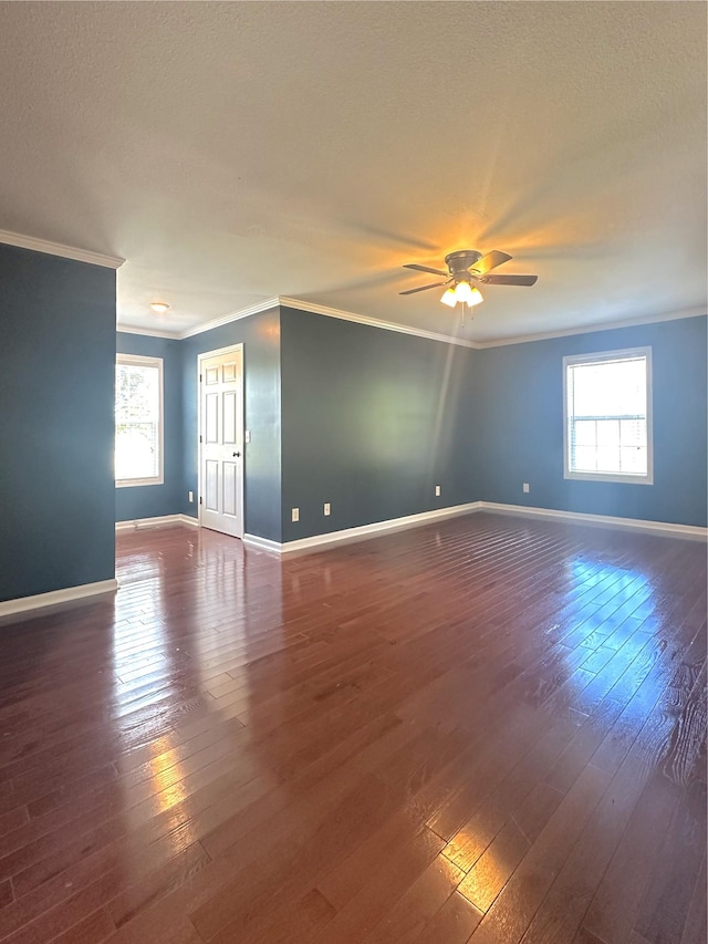 730 Everville Dr, Livingston, TN 38570 - spare room featuring crown molding, baseboards, dark wood-style flooring, and a ceiling fan