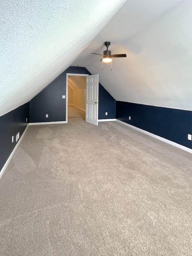 730 Everville Dr, Livingston, TN 38570 - bonus room featuring vaulted ceiling, carpet floors, a ceiling fan, a textured ceiling, and baseboards