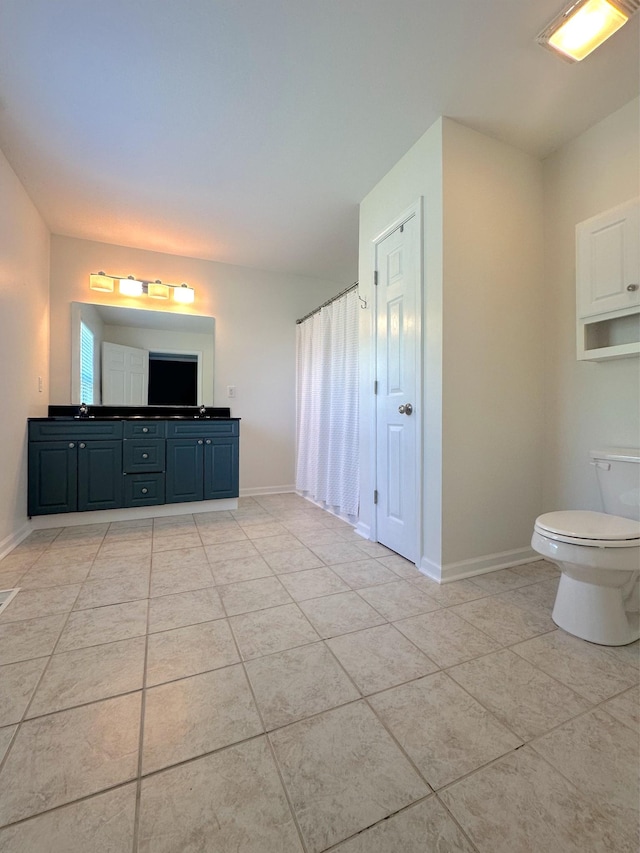 730 Everville Dr, Livingston, TN 38570 - bathroom featuring toilet, tile patterned floors, double vanity, and baseboards