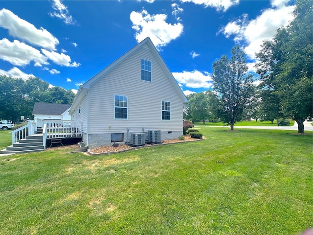 730 Everville Dr, Livingston, TN 38570 - view of side of home featuring a wooden deck, central AC, and a lawn