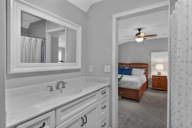 516 Main St, Burns, TN 37029 - bathroom featuring vanity, ensuite bathroom, vaulted ceiling, and a ceiling fan