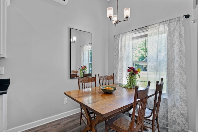 516 Main St, Burns, TN 37029 - dining area featuring plenty of natural light, wood finished floors, baseboards, and a chandelier
