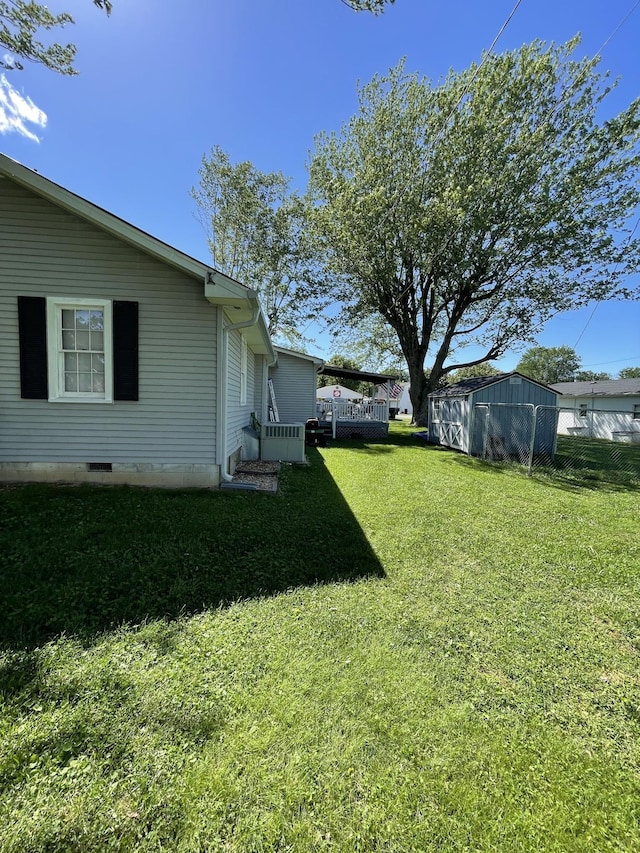903 Days Rd, Lafayette, TN 37083 - view of green lawn with a wooden deck
