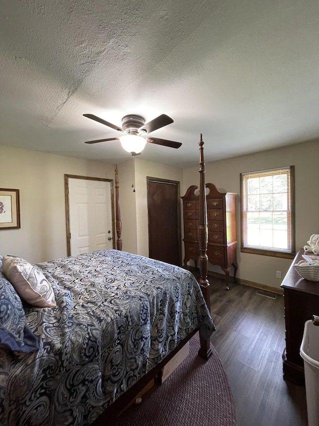 903 Days Rd, Lafayette, TN 37083 - bedroom featuring dark wood-type flooring, ceiling fan, a textured ceiling, and baseboards