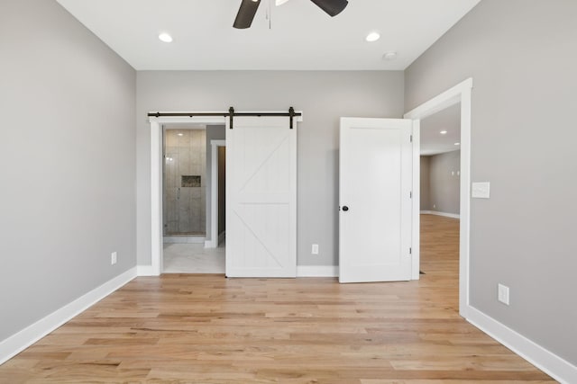47 Long Branch Rd, Lawrenceburg, TN 38464 - unfurnished bedroom featuring light wood-style flooring, baseboards, ensuite bath, and recessed lighting