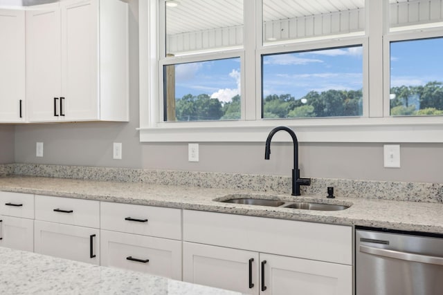 47 Long Branch Rd, Lawrenceburg, TN 38464 - kitchen featuring stainless steel dishwasher, a sink, white cabinets, and plenty of natural light