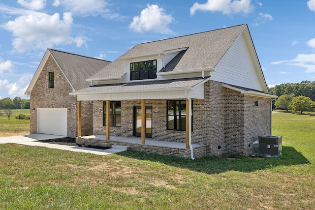 47 Long Branch Rd, Lawrenceburg, TN 38464 - view of front of home featuring central AC unit, brick siding, a front lawn, a shingled roof, and an attached garage