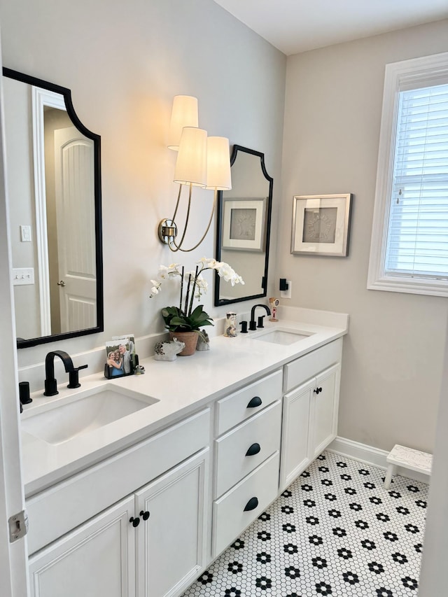 82 Addison Ave, Franklin, TN 37064 - full bathroom with double vanity, baseboards, and tile patterned floors