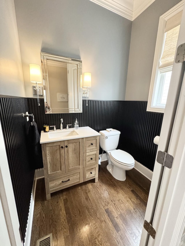 82 Addison Ave, Franklin, TN 37064 - bathroom with a wainscoted wall, vanity, toilet, crown molding, and wood finished floors