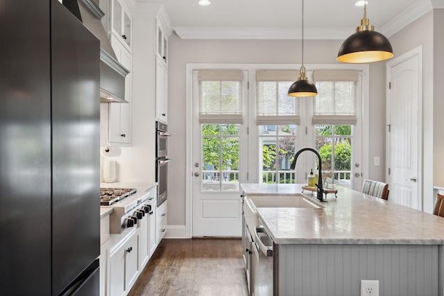 82 Addison Ave, Franklin, TN 37064 - kitchen with stainless steel appliances, an island with sink, plenty of natural light, ornamental molding, and dark wood-type flooring