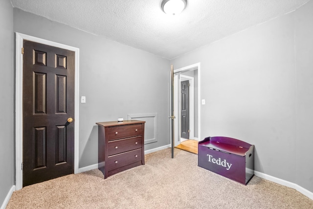 517 Ginkgo Dr, Clarksville, TN 37042 - bedroom with carpet, a textured ceiling, and baseboards