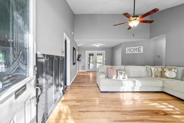 517 Ginkgo Dr, Clarksville, TN 37042 - living area with light wood-style flooring, ceiling fan, high vaulted ceiling, french doors, and baseboards