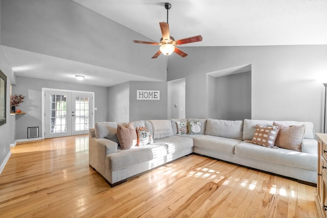 517 Ginkgo Dr, Clarksville, TN 37042 - living room featuring light wood-style floors, a ceiling fan, french doors, high vaulted ceiling, and baseboards