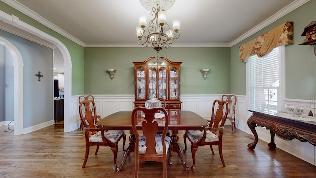 103 Doral Ln, Hendersonville, TN 37075 - dining room with a chandelier, arched walkways, crown molding, wood finished floors, and wainscoting