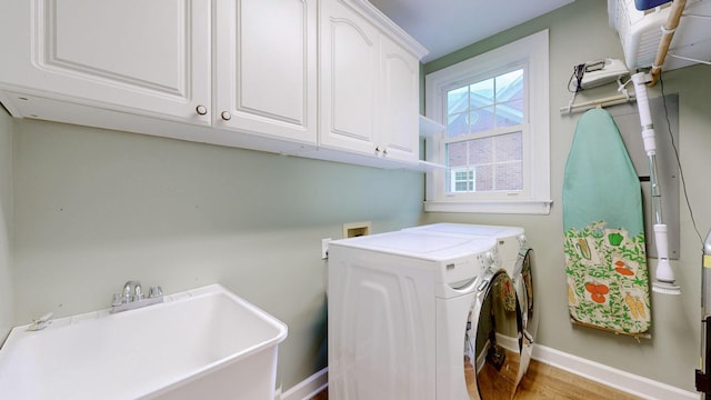 103 Doral Ln, Hendersonville, TN 37075 - laundry room with cabinet space, washer and dryer, wood finished floors, and baseboards