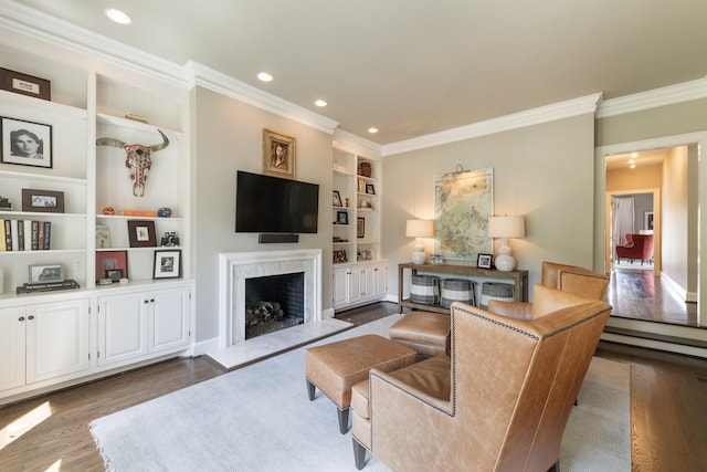 143 Prospect Hl, Nashville, TN 37205 - living room featuring ornamental molding, wood finished floors, a fireplace, built in features, and recessed lighting