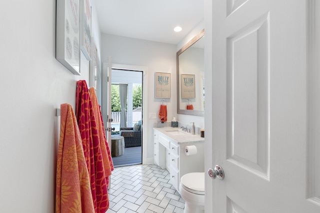 143 Prospect Hl, Nashville, TN 37205 - bathroom with vanity, toilet, brick patterned floors, and recessed lighting
