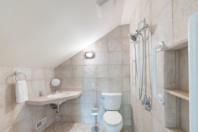 143 Prospect Hl, Nashville, TN 37205 - bathroom with vaulted ceiling, toilet, and tile walls