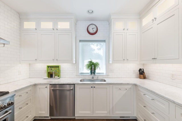143 Prospect Hl, Nashville, TN 37205 - kitchen with appliances with stainless steel finishes, a sink, white cabinets, and backsplash