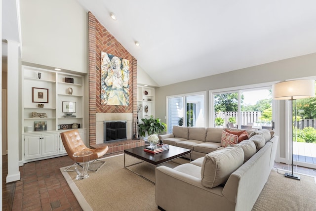 143 Prospect Hl, Nashville, TN 37205 - living room featuring high vaulted ceiling, a brick fireplace, brick flooring, and built in features